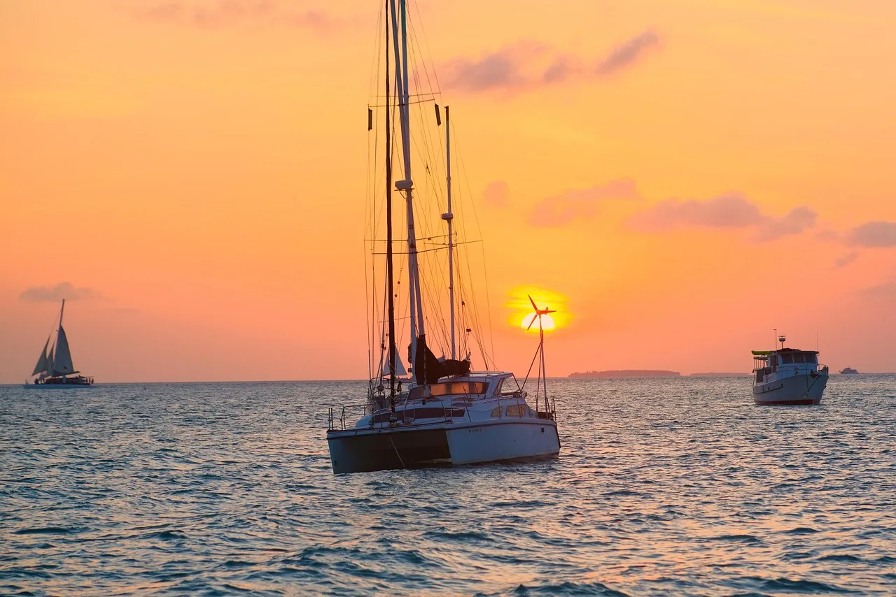 key west, florida, sunset, nature, boats, ocean, scenic, tropical paradise, coastal beauty, waterfront, golden hour, maritime, sunset colors, island life, tranquil sea, sailing, natural beauty, seascape, vacation destination, sea view, sun setting, idyllic scene, travel photography, ocean sunset, coastal sunset, key west sunset